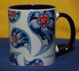 Blue mug with the author's signature